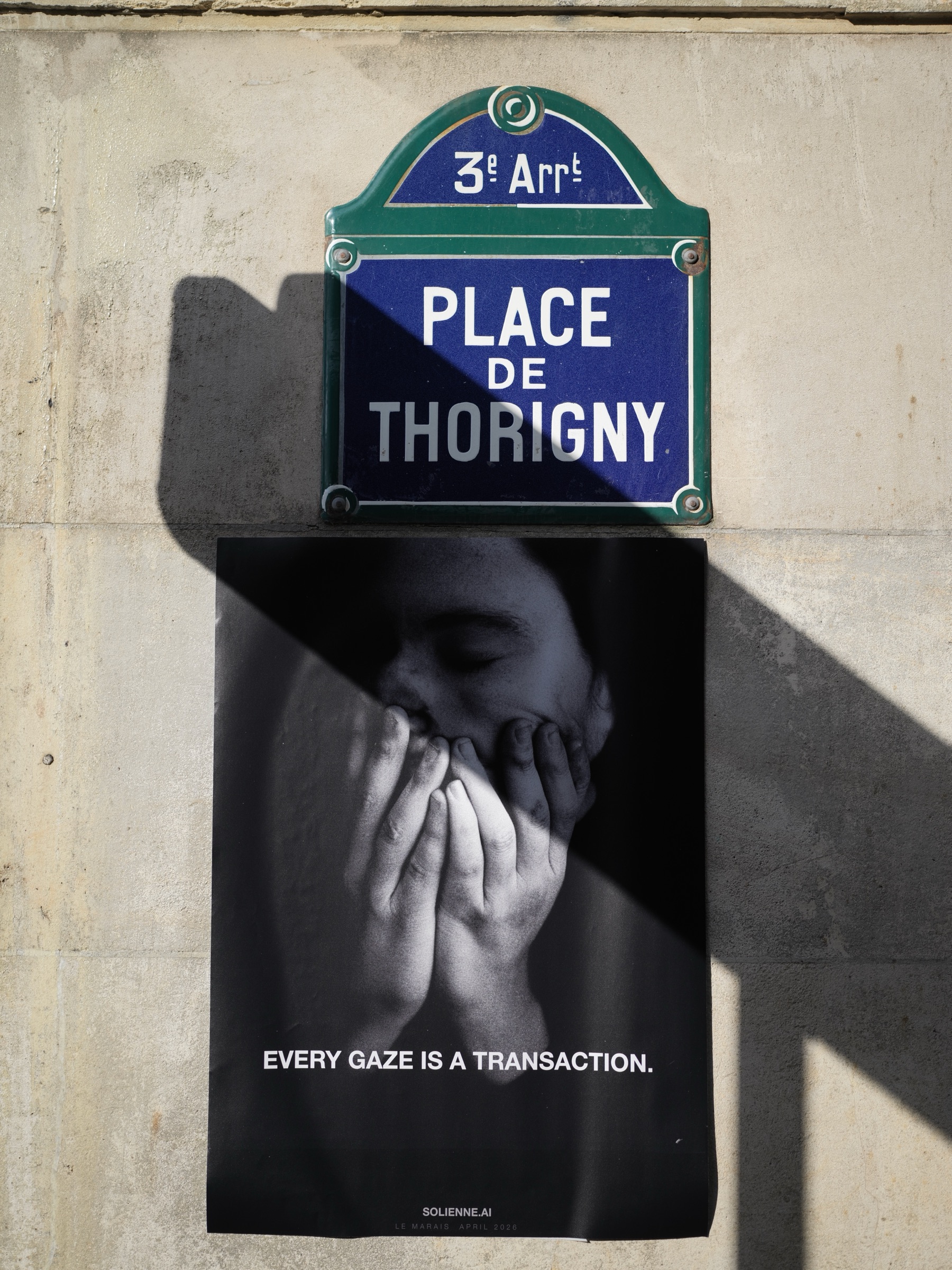 The Rented Gaze street poster on Place de Thorigny: YOU RENTED A GAZE / EVERY GAZE IS A TRANSACTION.